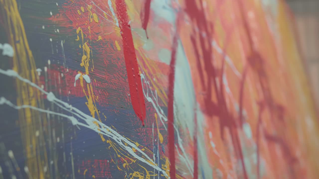 Holding Paint Brush And Drawing Painting With Red Paint