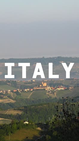 vertical video aerial drone shot of villages and mountains in italy with animated graphic spelling out italy