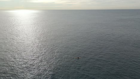 Fishing-Kayak,-Ocean,-and-sunrise-sunset-horizon