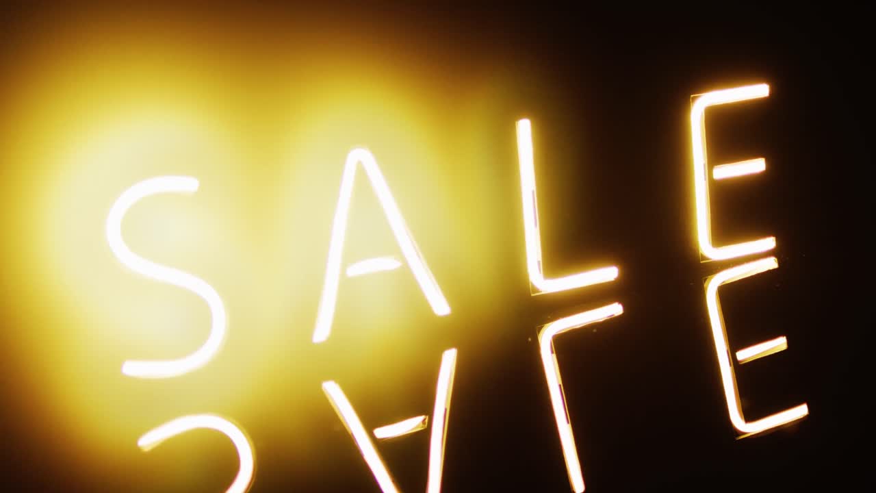 composición de texto de venta de neón en fondo negro