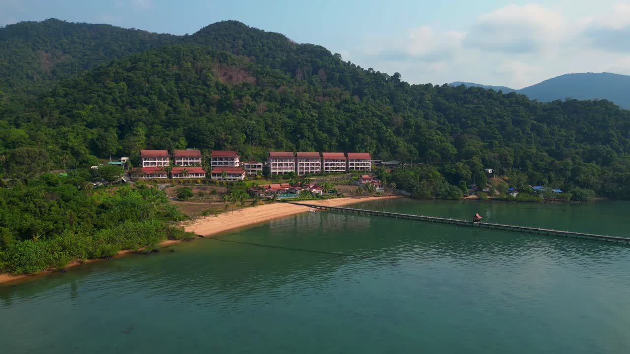 long pier reaching a beautiful resort by the sea in a tropical island koh chang. Best aerial view flight speed ramp hyper motion time lapse
