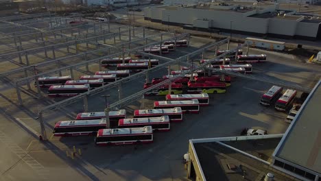TTC public transit buses at large operations, maintenance and storage facility revealing empty parking spaces
