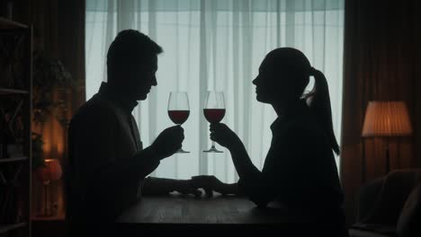 couple enjoying wine together in the evening