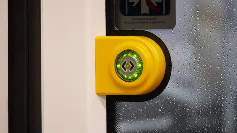 train door button with green light