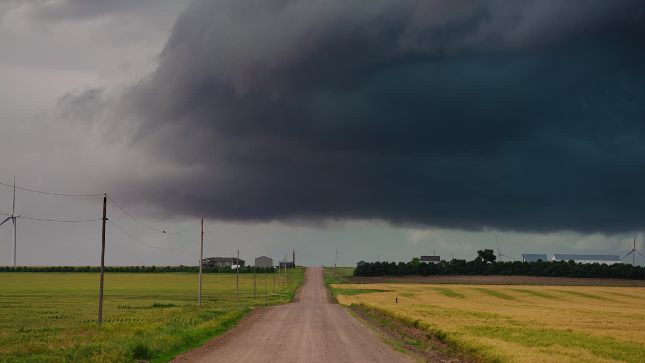 Rain Storm Clouds Gather Creating Intense Moody Sky Over Quiet Countryside