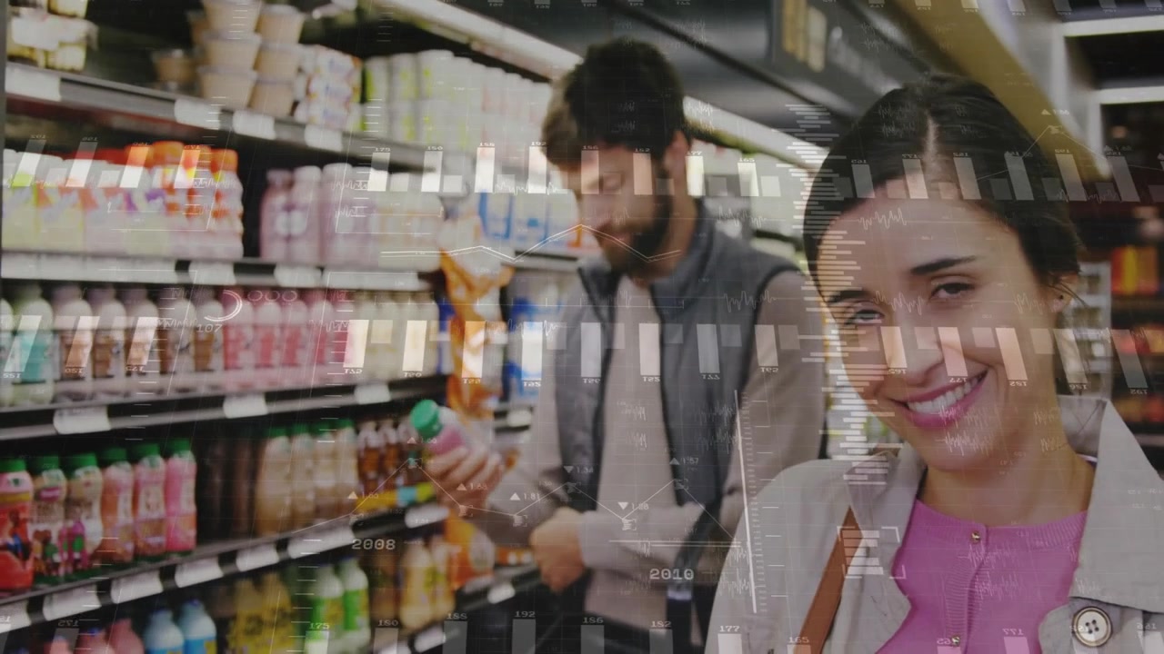 Woman browsing retail aisle picking pink drink and reading label as man placing bottle into basket
