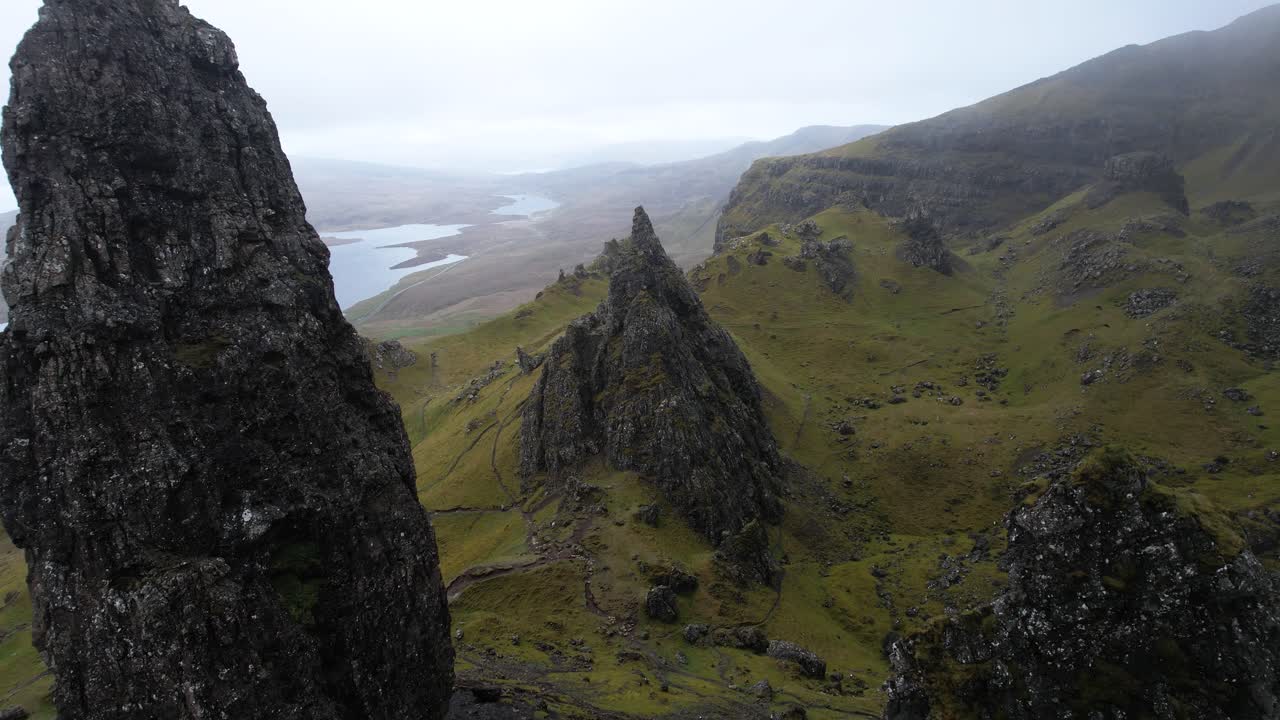 Epic aerial fly through backwards reveal shot of the old man of Storr on isle of Skye