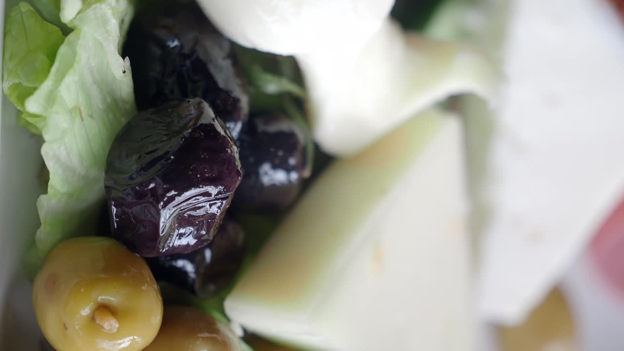 Close-up of a Fresh Salad with Olives and Cheese