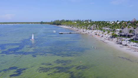 drone flying over bavaro beach and jetty, punta cana in dominican republic