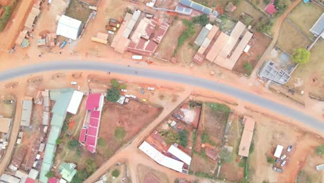 urban-setting-with-unassuming-buildings-and-poor-roads-in-Kenya,-Africa