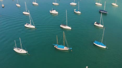 aerial view from drone of harbor with yacht, motorboat and sailboat