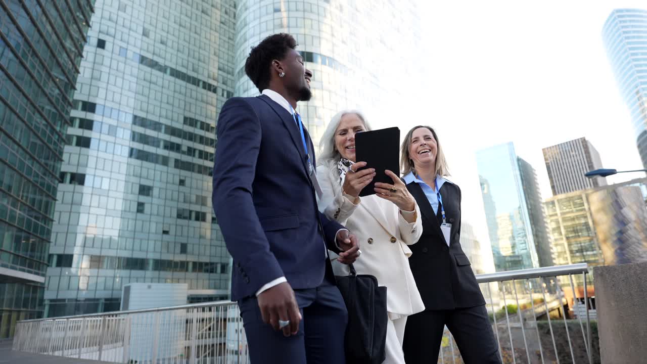 Business people walking and talking in a modern city