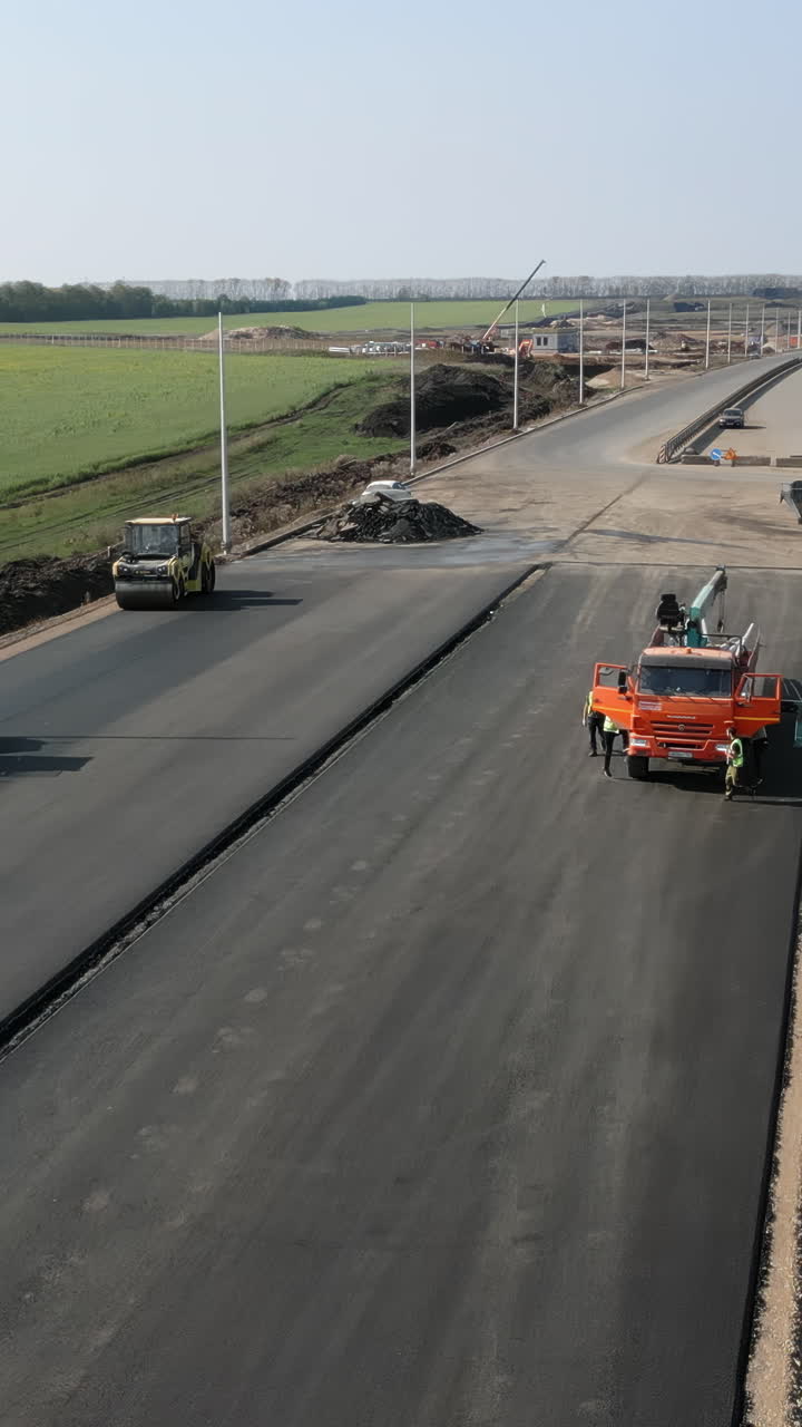 Road construction with asphalt paving and heavy machinery