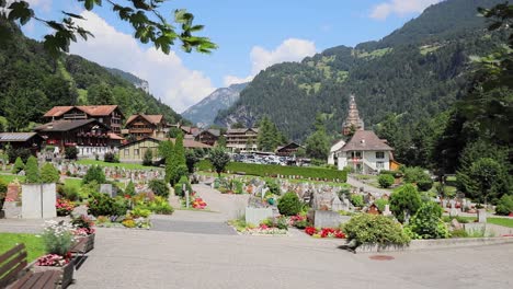 Beautiful-Grave-Between-The-Mountain-With-Church-in-Switzerland-in-Cinematic-Sliding-Movement