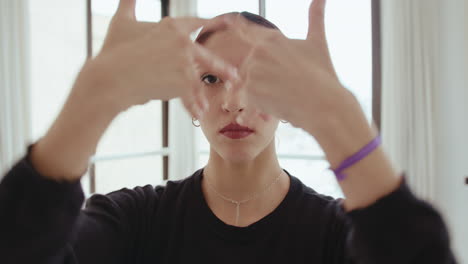 young pretty girl looking at camera while dancing contemporary style