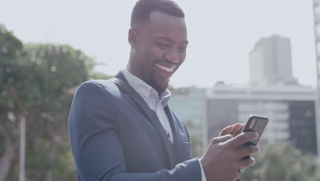 Excited-black-business-man-laughing-on-video-call