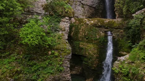 aerial view of water falling at ujëvara and peshturës waterfalls in albania