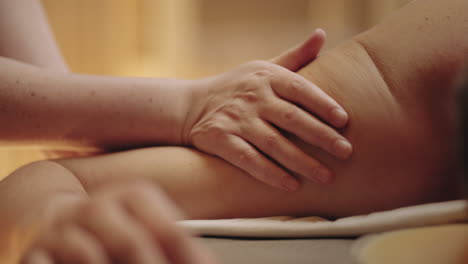 relax-treatment-in-spa-salon-man-is-relaxing-in-massage-masseuse-is-stroking-arms-muscles