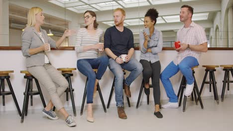 People-with-coffee-listening-to-their-colleague