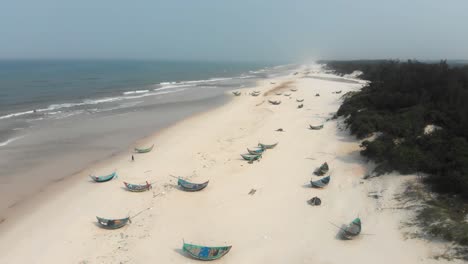 local trung thanh beach at vietnam with fishing boats on shore, aerial