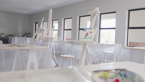 video of school class with easels prepared for art lessons