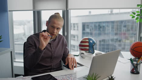 Serious-man-video-calling-laptop-modern-flat-close-up.-Business-couch-explaining