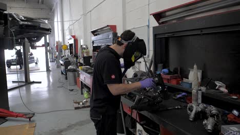 welding-in-slow-motion-in-a-mechanic-garage