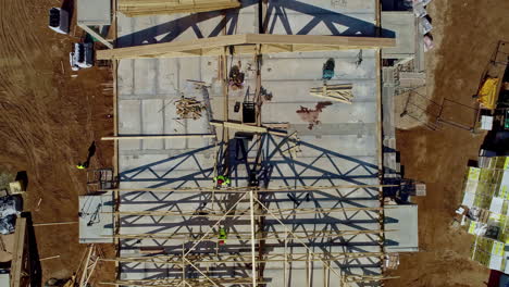 top view of people walking and working on a building construction site