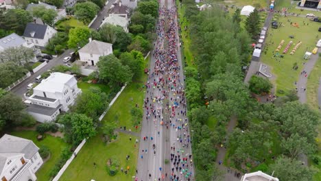 people gathering at start of urban street marathon in reykjavik, aerial