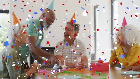 confetti animation over group of people celebrating at party with hats and gifts