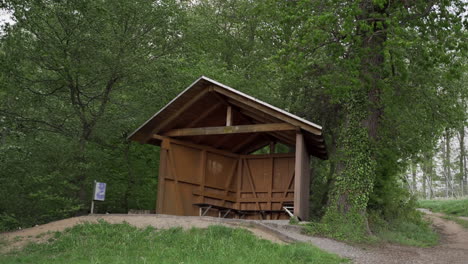 empty shelter in forest on stormy day