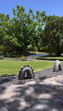 japanese garden with water feature and sculptures