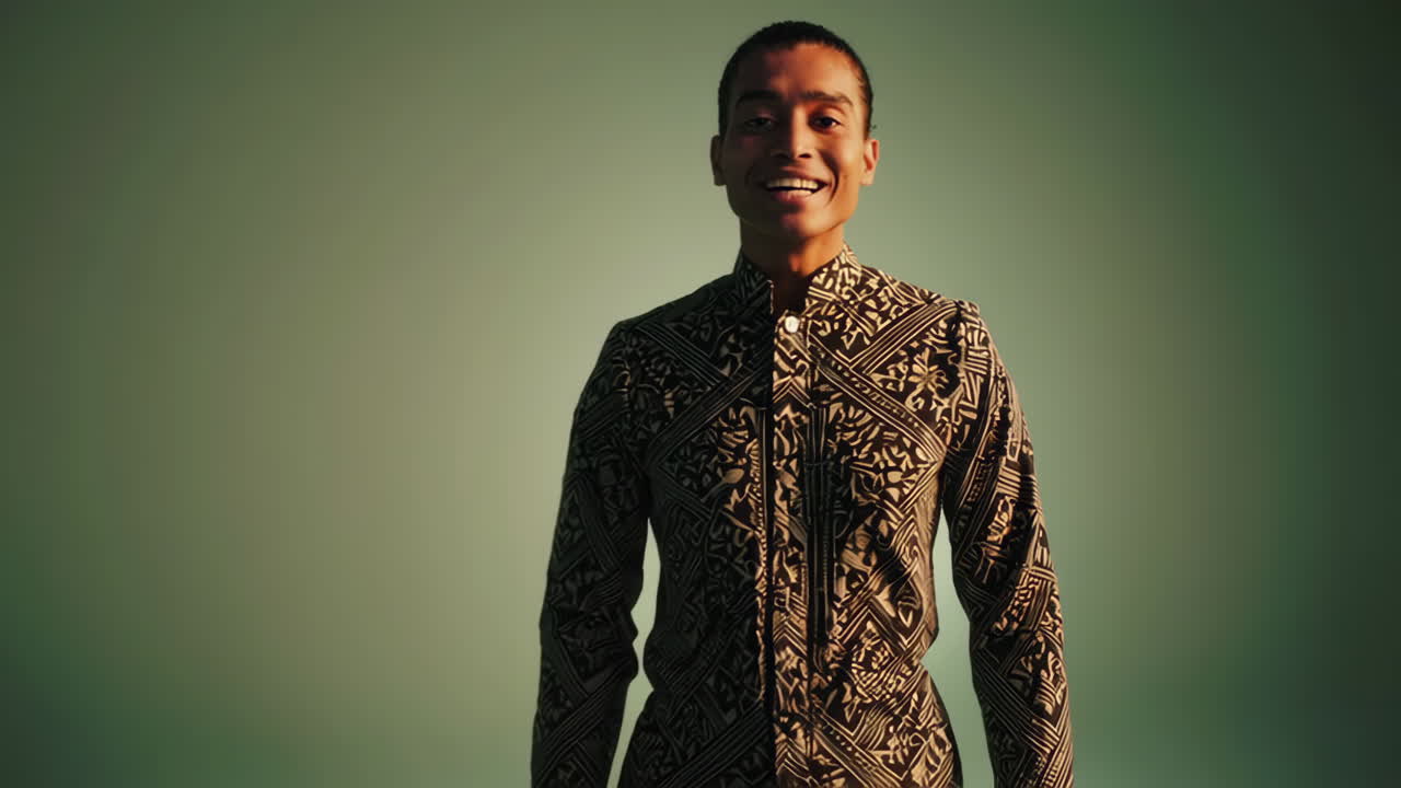Expressive Young Man in Patterned Shirt in Studio