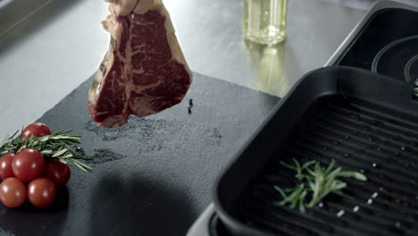 chef hands cooking meat at griddle