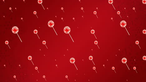 animation of lollipops falling on red background