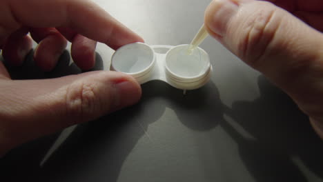 putting in contact lenses
