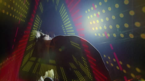 female vocalist silhouette performing on concert stage, with vivid led dots forming radial patterns