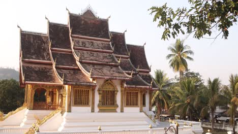 exterior-of-Wat-Xieng-Thong-buddhist-temple-in-Luang-Prabang,-Laos-traveling-Southeast-Asia