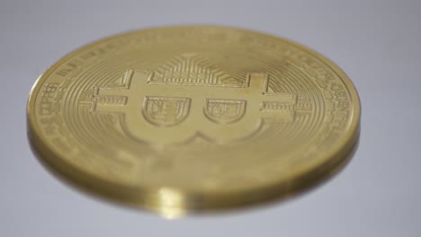 Bitcoin-token-on-a-turning-table-close-up