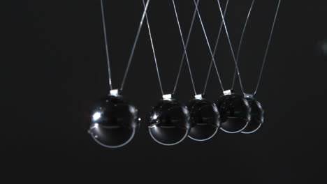 close up of newtons cradle