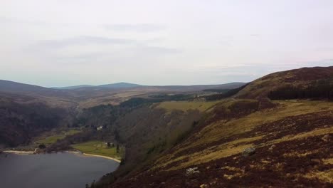 Lough-Tay-or-The-Guinness-Lake-in-County-Wicklow,-so-called-because-of-it's-black-coloured-lake-water-caused-by-the-run-off-from-the-glacial-mountains-surrounding-it