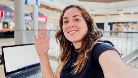 young woman using laptop for a video call