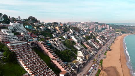 Aerial-drone-view-of-beachfront-peculiar-shape-luxurious-buildings-in-Reñaca,-Valparaiso-chilean-coast