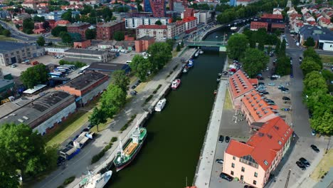 Aerial-View-of-Port-of-Klaipeda-canal-and-city-in-the-background-on-a-summer-day---Lithuania