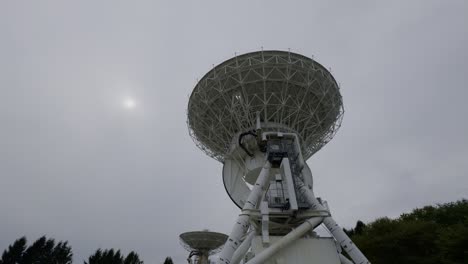 iwate’s radio telescope under cloudy skies a scenic view of the radio telescope in iwate, japan, standing tall against the cloudy, moody skies
