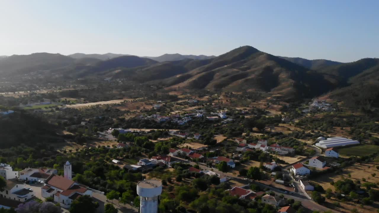 Drone shot of the hills, vallies and fields by Salir in Algarve, Portugal.