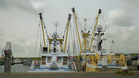 Steady-shot-of-two-dutch-fishing-trawlers-moored-in-the-harbour-of-Texel