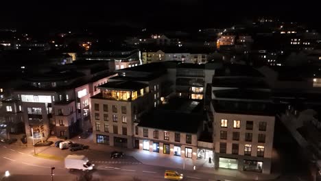 Drone-at-night-panning-along-Glategny-Esplanade-St-Peter-Port-Guernsey-to-town-seafront