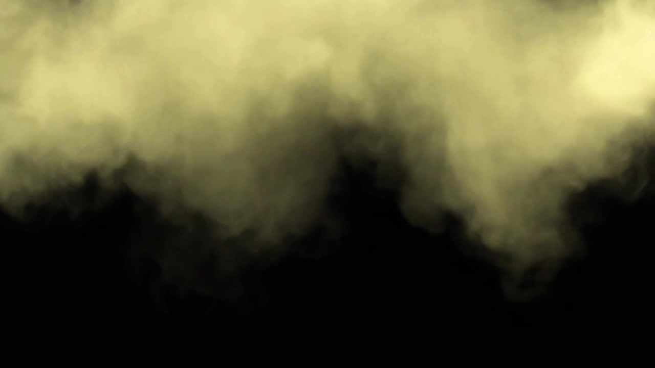 Fumo giallo o nebbia che si espande su sfondo nero