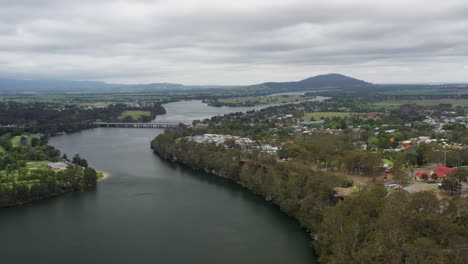 Aerial-drone-shot-tracking-to-the-left-around-Nowra-and-the-Shoalhaven-river-on-a-stormy-day-in-south-coast-NSW-Australia